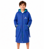 A young boy wearing a royal blue hooded bathrobe with teal lining and multicolor piping details, standing against a plain white background.